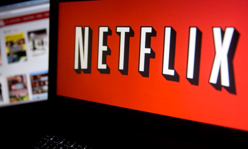 The Netflix Inc. website and logo are displayed on laptop computers arranged for a photograph in Washington, D.C., U.S., on Tuesday, Jan. 21, 2014. Netflix Inc., the largest subscription streaming service, is expected to release earnings data on Jan. 22. Photographer: Andrew Harrer/Bloomberg via Getty Images
